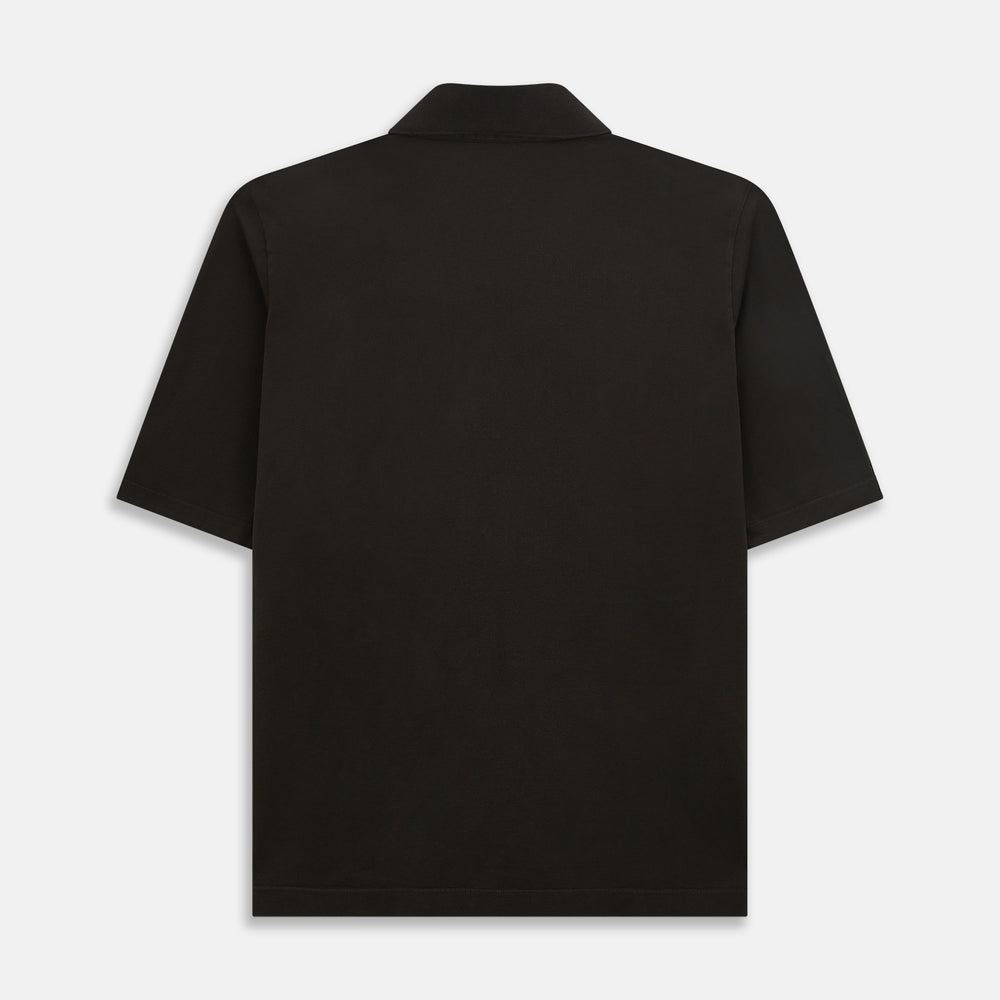 A brown short-sleeve polo shirt by Turnbull & Asser, crafted from pure cotton jersey with a collar, three buttons, and a buttoned chest pocket, laid flat on a white background.