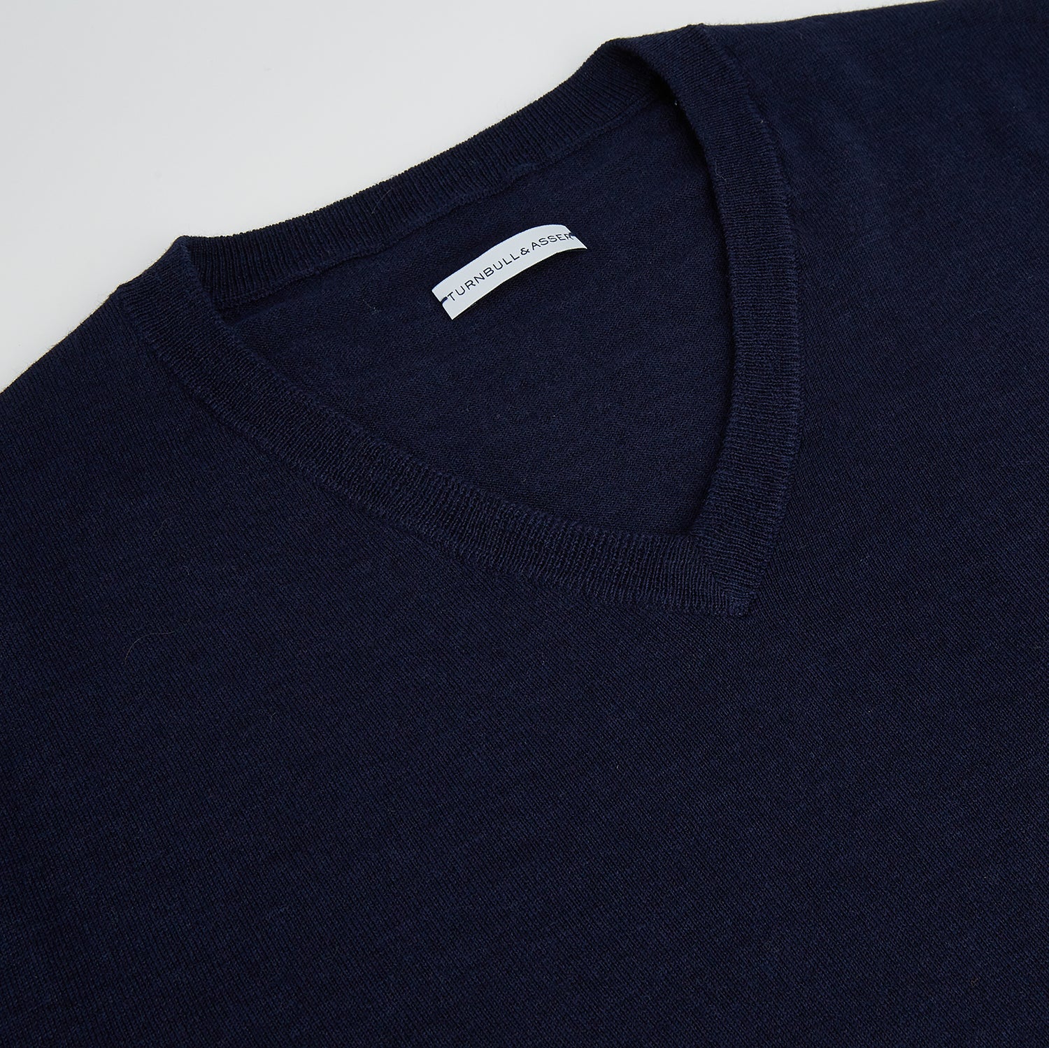 View 2 of product Navy Fine Merino V-Neck Jumper