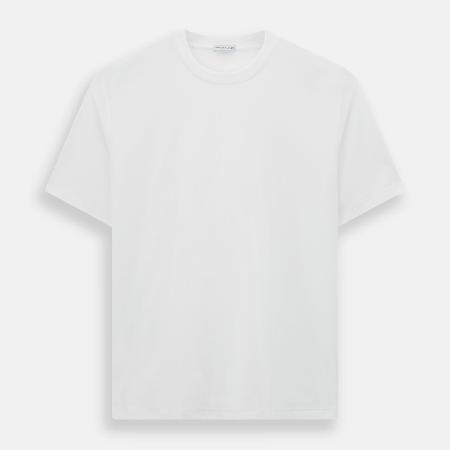 View 1 of product The Turnbull & Asser White Short-sleeve Pyjama Shirt is shown laid flat on a white background, featuring a plain, logo-free design for effortless comfort and classic loungewear style.