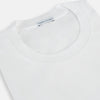 View 2 of product The Turnbull & Asser White Short-sleeve Pyjama Shirt is shown laid flat on a white background, featuring a plain, logo-free design for effortless comfort and classic loungewear style.