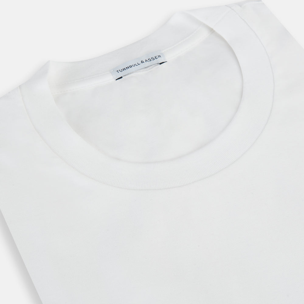 The Turnbull & Asser White Short-sleeve Pyjama Shirt is shown laid flat on a white background, featuring a plain, logo-free design for effortless comfort and classic loungewear style.