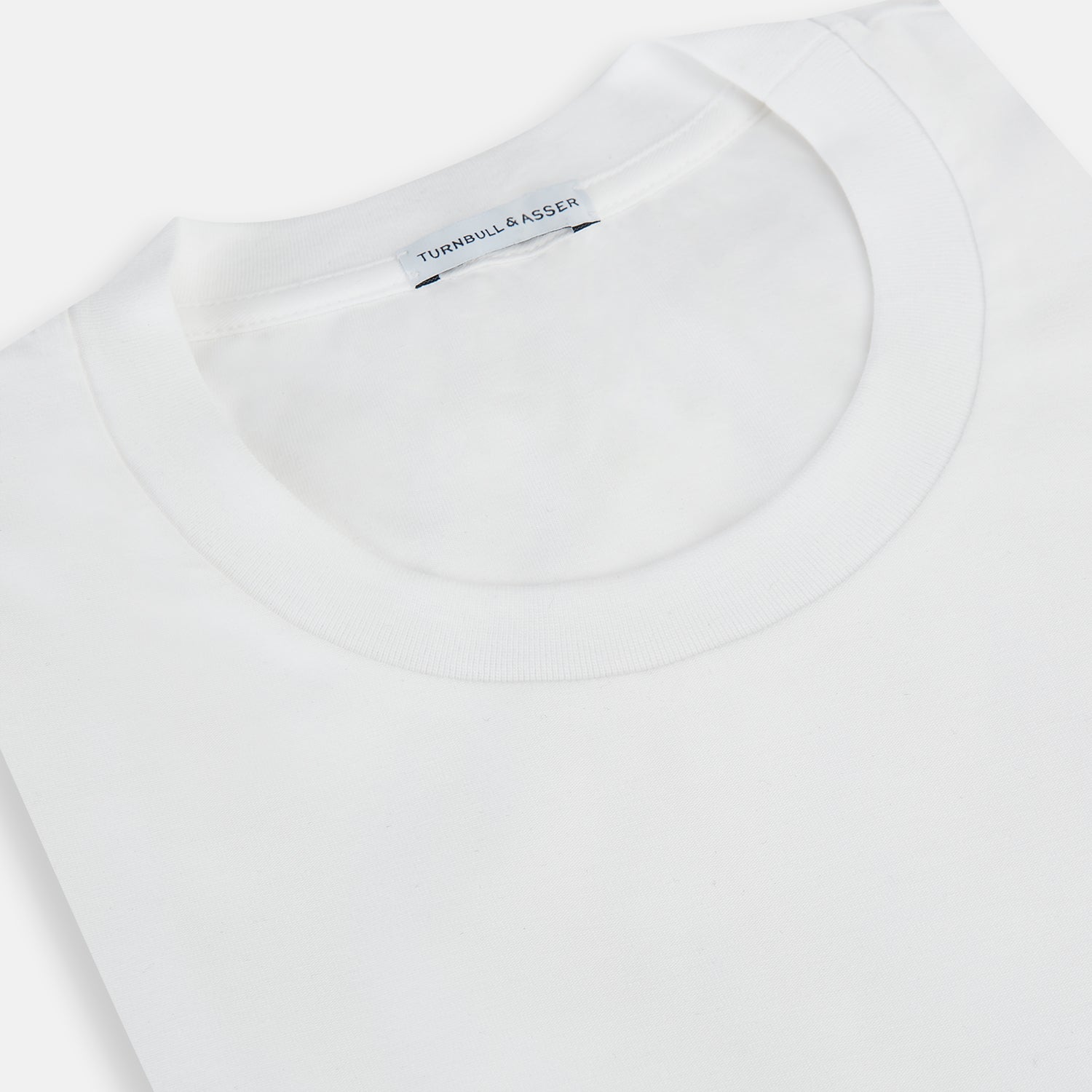 View 2 of product The Turnbull & Asser White Short-sleeve Pyjama Shirt is shown laid flat on a white background, featuring a plain, logo-free design for effortless comfort and classic loungewear style.