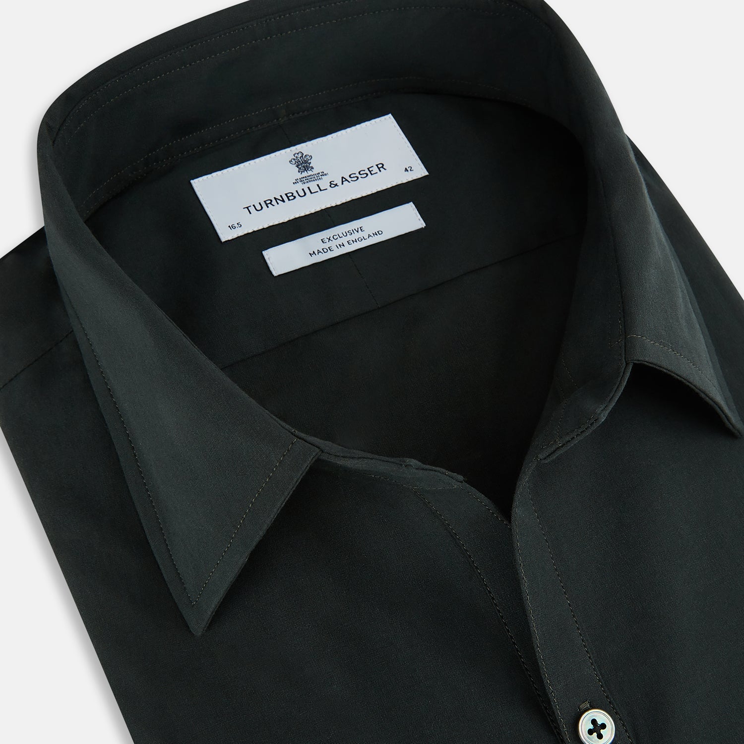 View 2 of product The FOREST GREEN WINDSOR SHIRT by Turnbull & Asser features long sleeves, a Windsor collar, and buttoned cuffs, exemplifying British craftsmanship. Displayed on a plain white background.