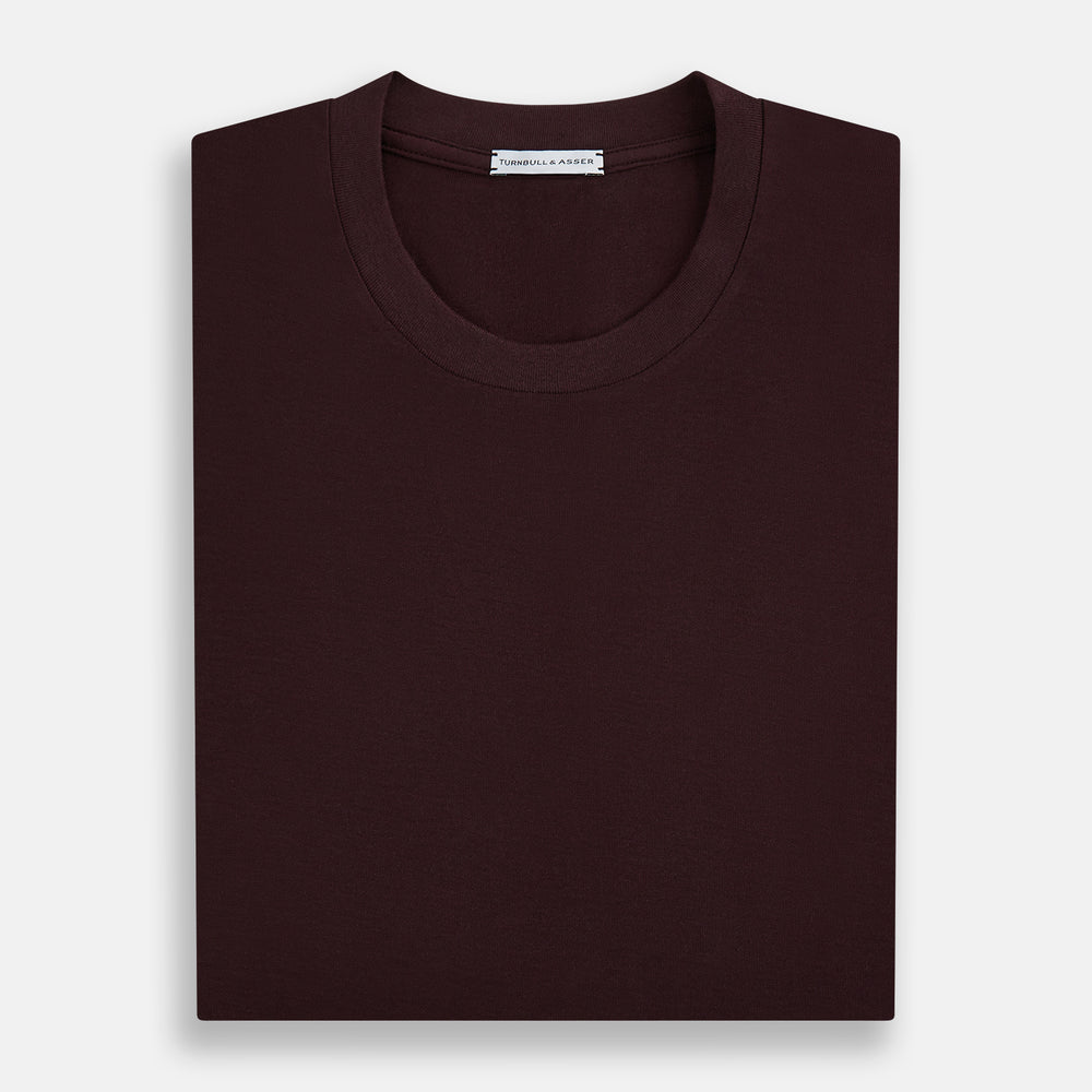 The Turnbull & Asser Burgundy Short-Sleeve T-shirt features a crew neckline and quality fabric, shown on a white background—ideal for versatile everyday wear.