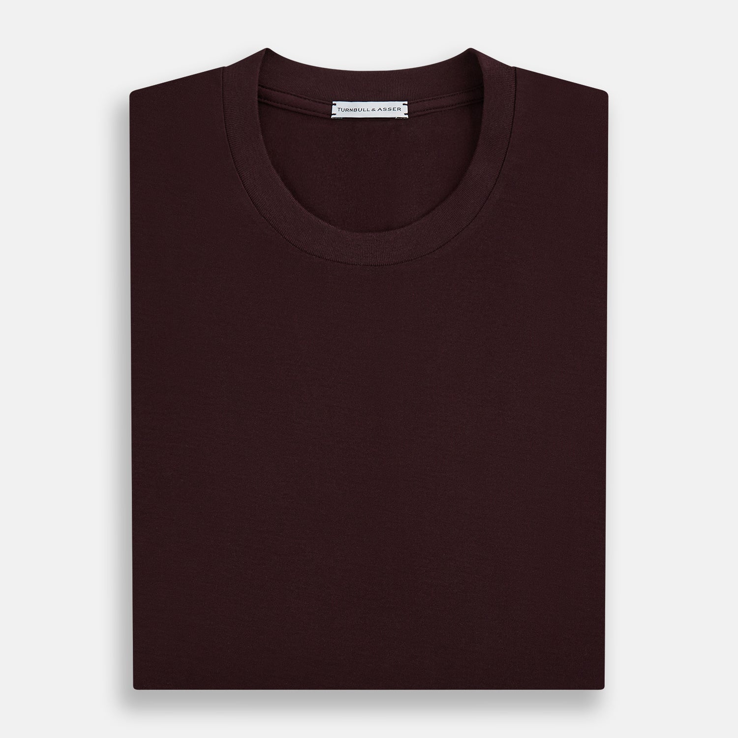 View 5 of product The Turnbull & Asser Burgundy Short-Sleeve T-shirt features a crew neckline and quality fabric, shown on a white background—ideal for versatile everyday wear.