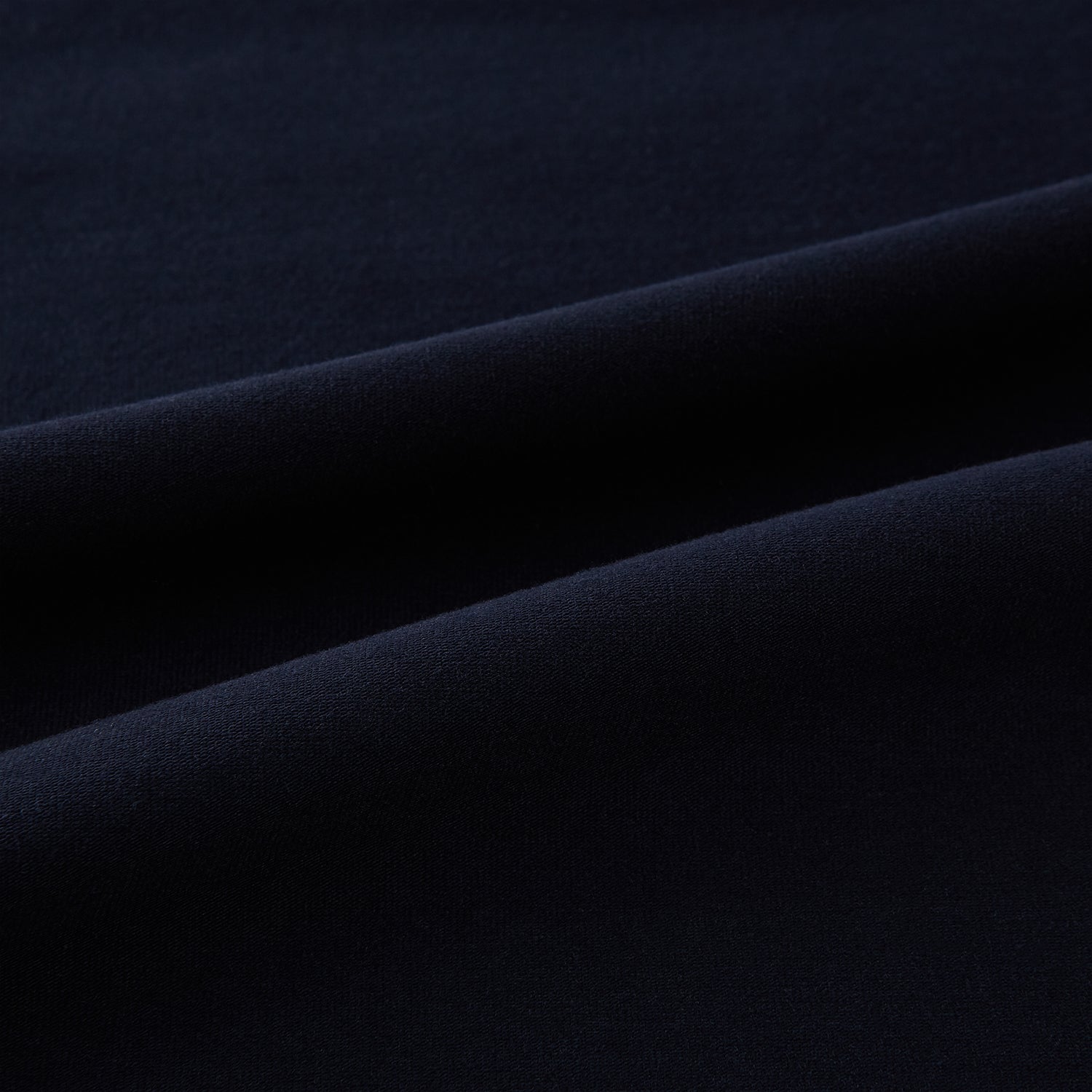 View 6 of product A navy short-sleeve pyjama shirt by Turnbull & Asser is laid flat on a white background, featuring a round neckline and a minimalist design—perfect for relaxed wear.