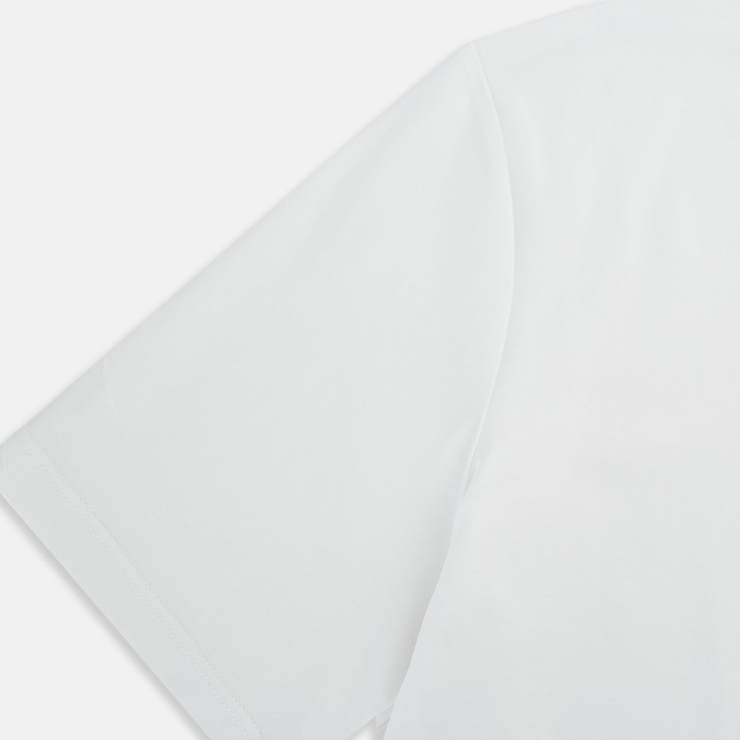 View 4 of product The Turnbull & Asser White Short-sleeve Pyjama Shirt is shown laid flat on a white background, featuring a plain, logo-free design for effortless comfort and classic loungewear style.