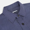 View 2 of product The Navy Stripe Highbury Overshirt by Turnbull & Asser features thin vertical stripes, black buttons, a collar, and a chest pocket. Displayed on a plain white background, it’s inspired by classic Turnbull & Asser style.