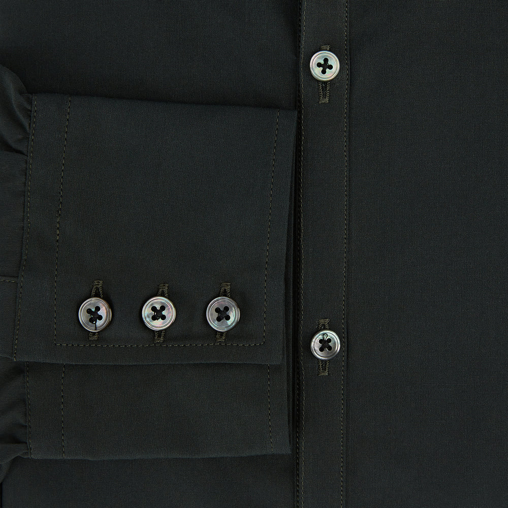 The FOREST GREEN WINDSOR SHIRT by Turnbull & Asser features long sleeves, a Windsor collar, and buttoned cuffs, exemplifying British craftsmanship. Displayed on a plain white background.