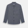 View 1 of product The Navy Stripe Highbury Overshirt by Turnbull & Asser features thin vertical stripes, black buttons, a collar, and a chest pocket. Displayed on a plain white background, it’s inspired by classic Turnbull & Asser style.