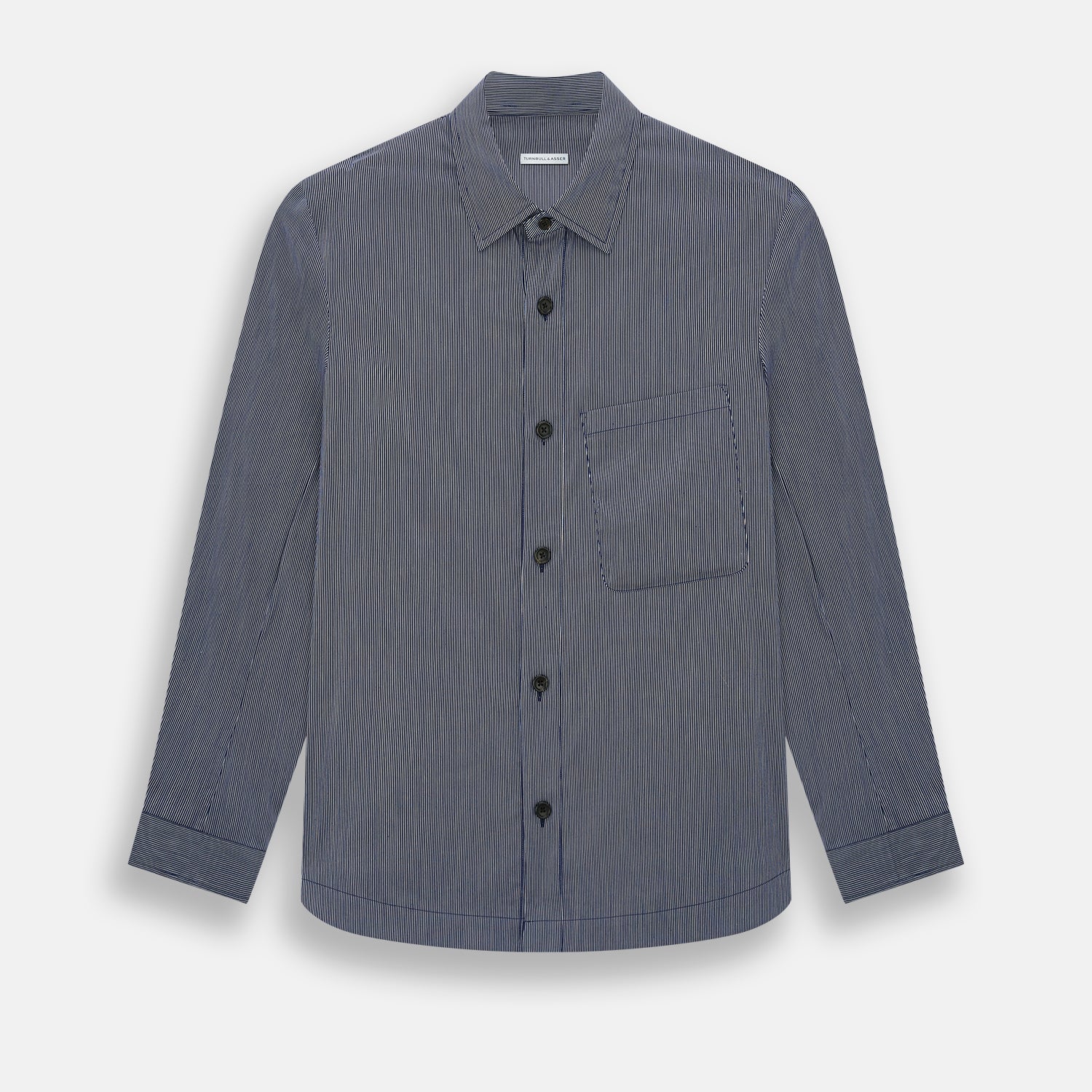 View 1 of product The Navy Stripe Highbury Overshirt by Turnbull & Asser features thin vertical stripes, black buttons, a collar, and a chest pocket. Displayed on a plain white background, it’s inspired by classic Turnbull & Asser style.