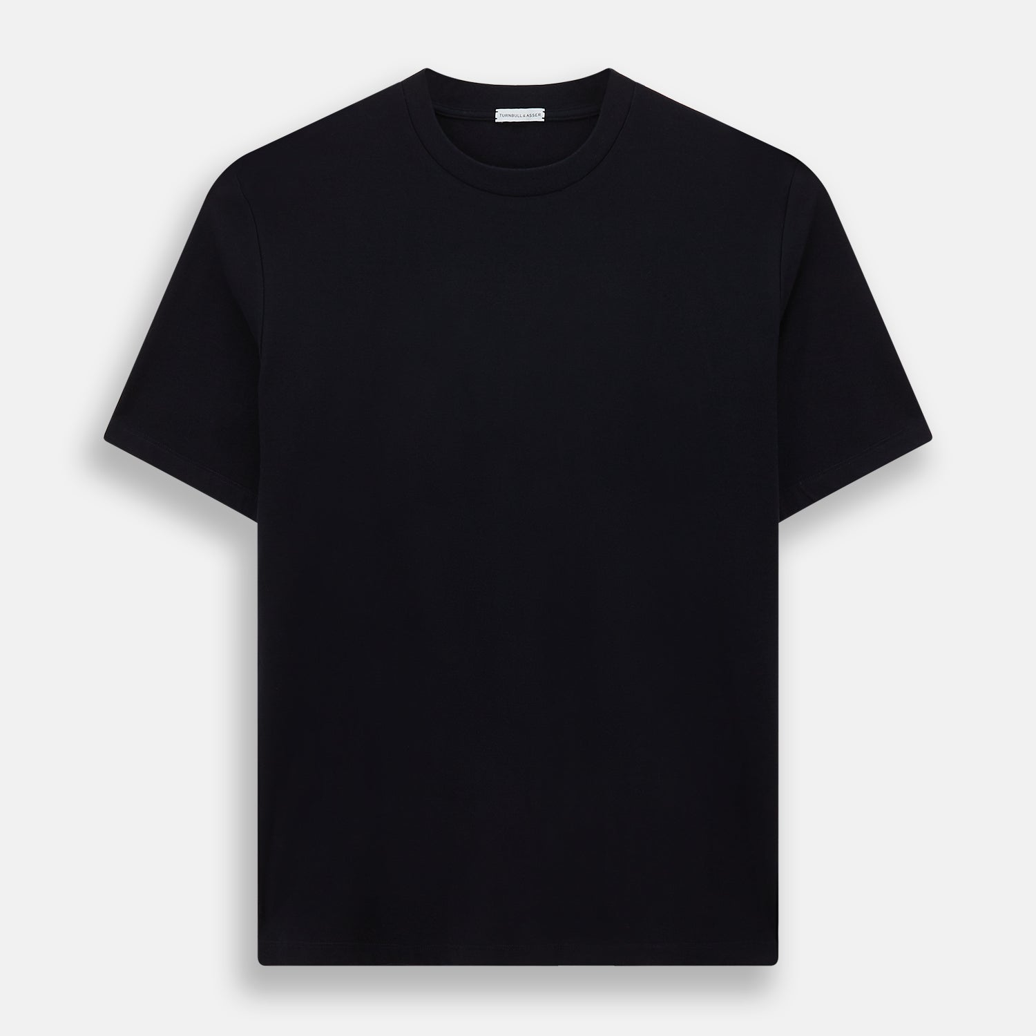 View 1 of product A navy short-sleeve pyjama shirt by Turnbull & Asser is laid flat on a white background, featuring a round neckline and a minimalist design—perfect for relaxed wear.