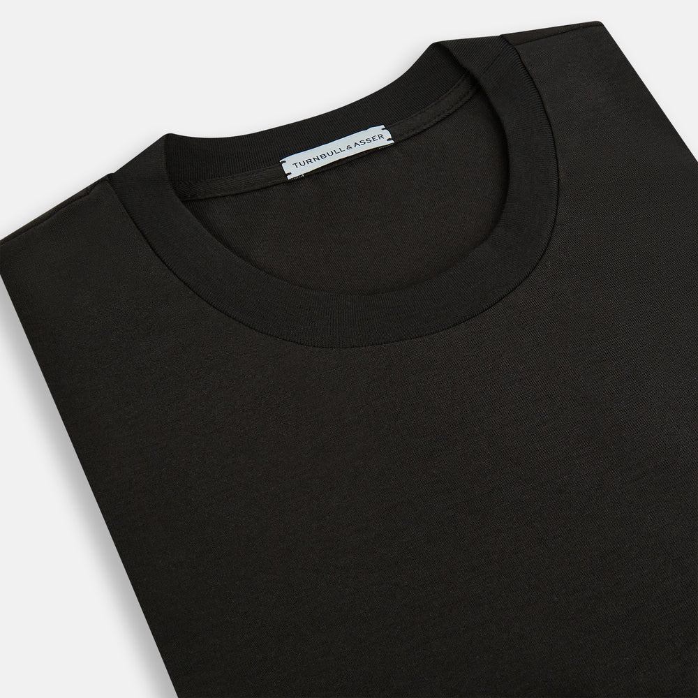 The Turnbull & Asser Dark Chocolate Long-Sleeve T-shirt features a minimalist crew neck design with no visible logos or patterns, shown laid flat on a white background for a versatile, understated look.