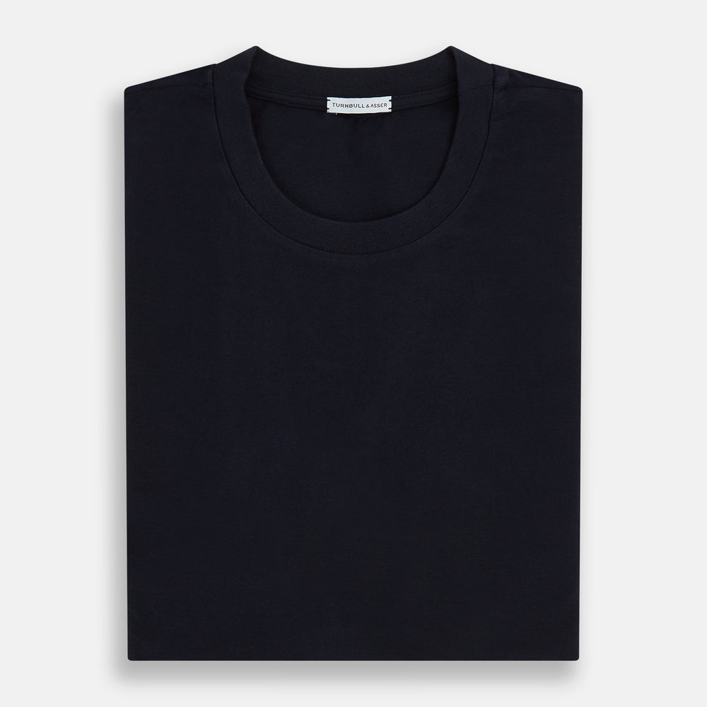A navy short-sleeve pyjama shirt by Turnbull & Asser is laid flat on a white background, featuring a round neckline and a minimalist design—perfect for relaxed wear.