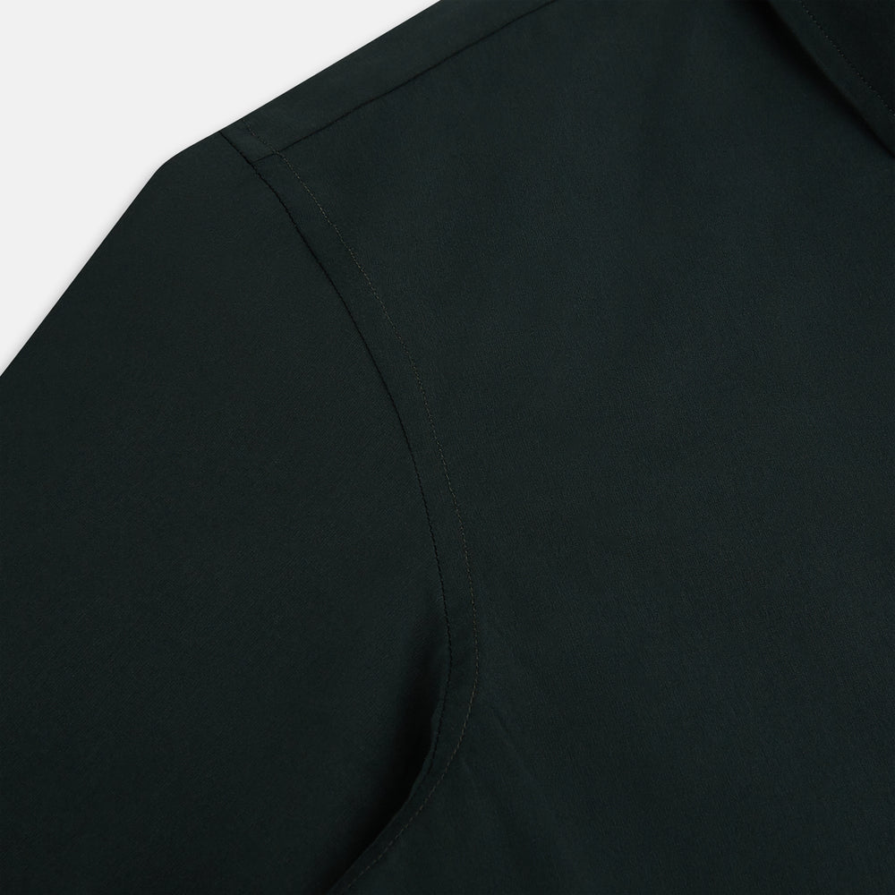 The FOREST GREEN WINDSOR SHIRT by Turnbull & Asser features long sleeves, a Windsor collar, and buttoned cuffs, exemplifying British craftsmanship. Displayed on a plain white background.