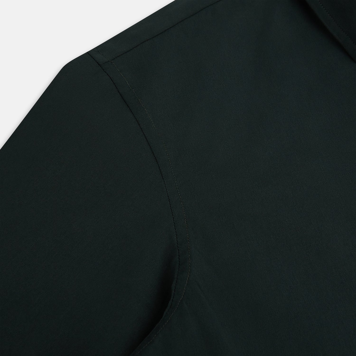View 6 of product The FOREST GREEN WINDSOR SHIRT by Turnbull & Asser features long sleeves, a Windsor collar, and buttoned cuffs, exemplifying British craftsmanship. Displayed on a plain white background.