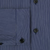 View 4 of product The Navy Stripe Highbury Overshirt by Turnbull & Asser features thin vertical stripes, black buttons, a collar, and a chest pocket. Displayed on a plain white background, it’s inspired by classic Turnbull & Asser style.