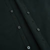 View 7 of product The FOREST GREEN WINDSOR SHIRT by Turnbull & Asser features long sleeves, a Windsor collar, and buttoned cuffs, exemplifying British craftsmanship. Displayed on a plain white background.