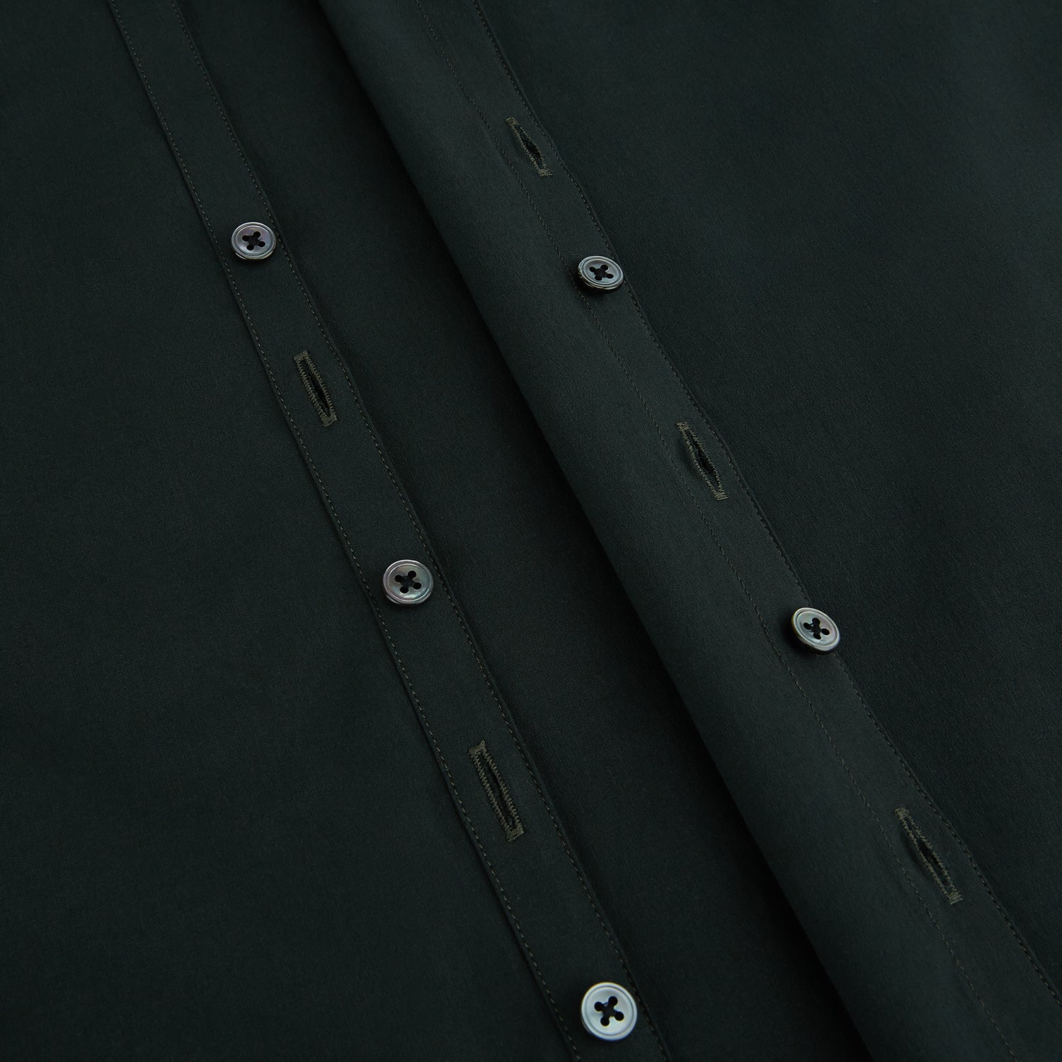 View 7 of product The FOREST GREEN WINDSOR SHIRT by Turnbull & Asser features long sleeves, a Windsor collar, and buttoned cuffs, exemplifying British craftsmanship. Displayed on a plain white background.
